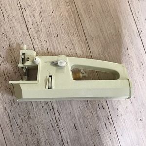 Handheld vintage sewing machine